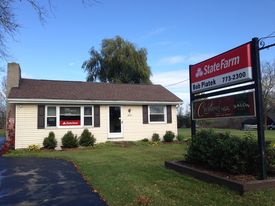 Photo of office front with sign