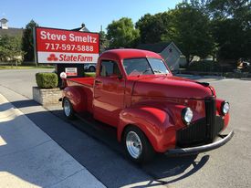 Truck in front of sign